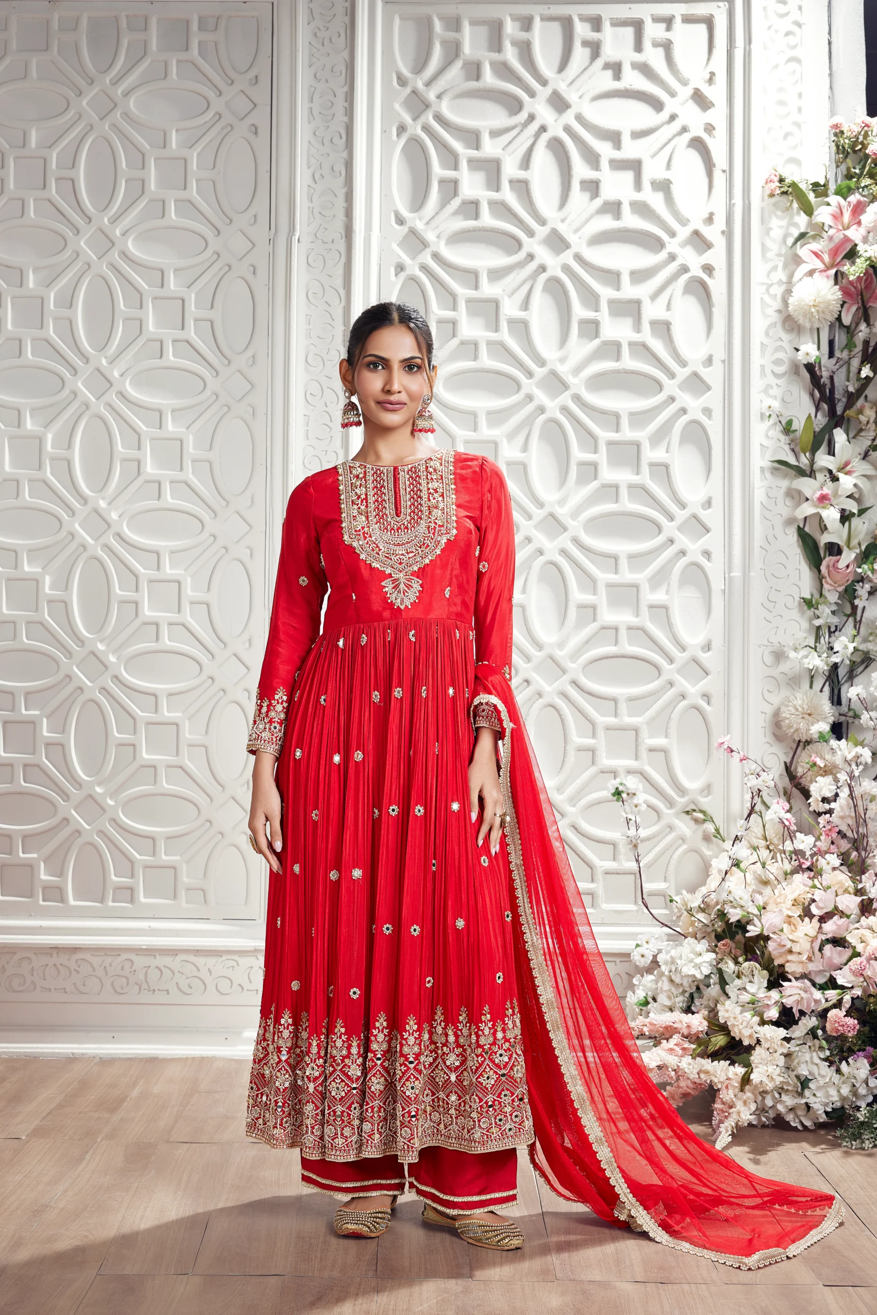 Model in a red embroidered RP Dalmia anarkali suit