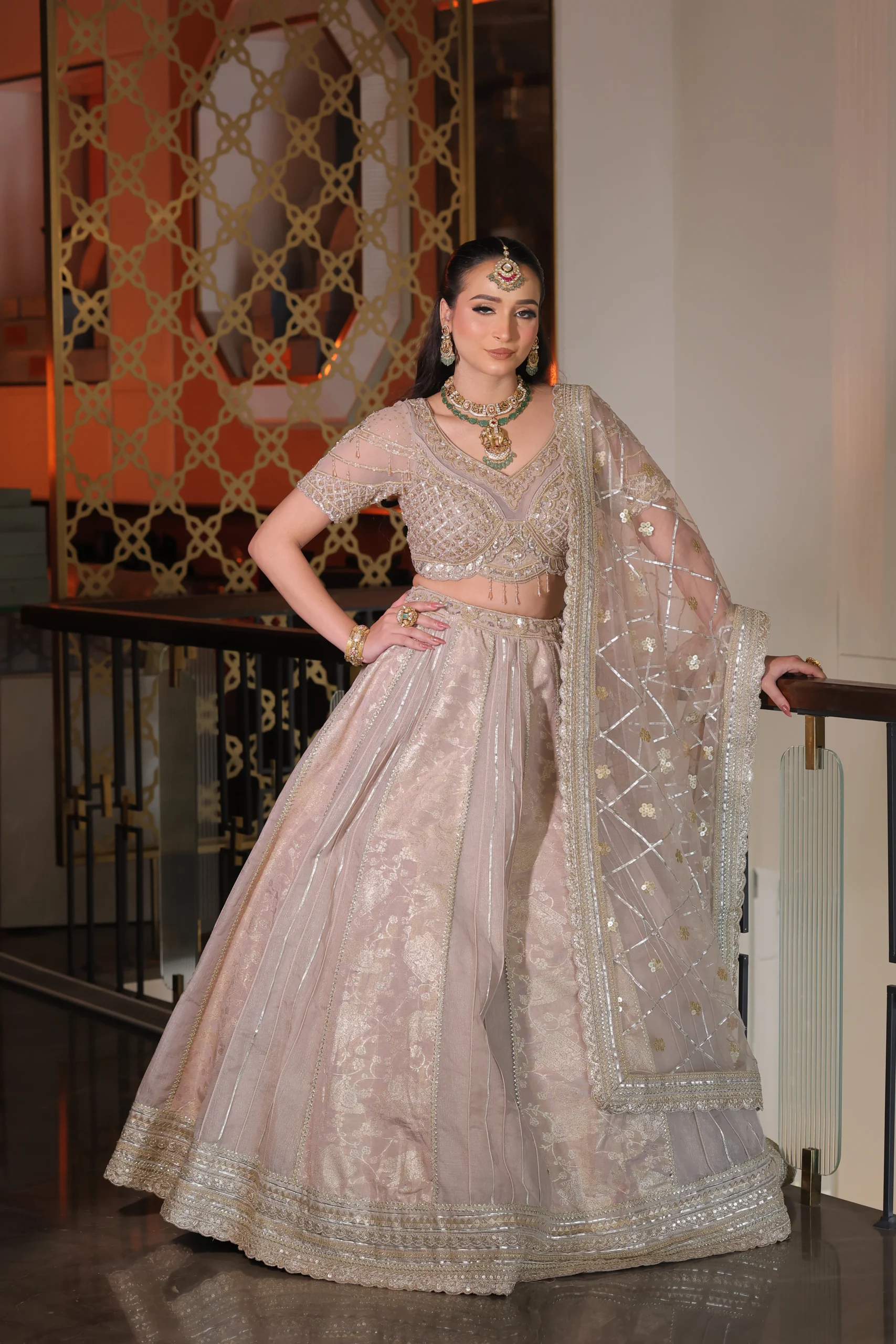 Model in a blush RP Dalmia bridal lehenga